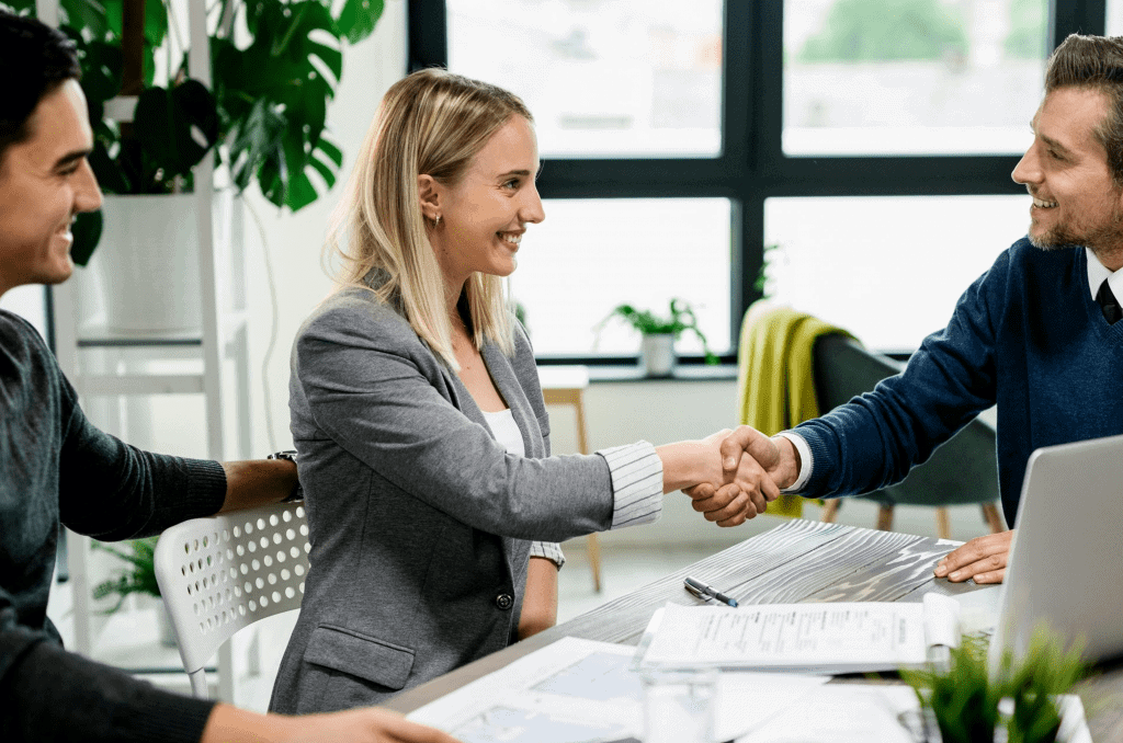 business insurance agents at The Allen Thomas Group working with a client business insurance agents at The Allen Thomas Group working with a client