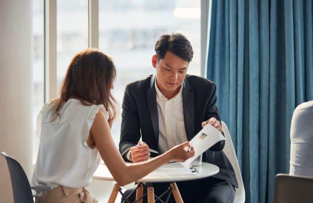 California insurance agent from The Allen Thomas Group working with a client