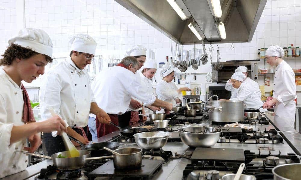 chefs preparing dish for guests at Illinois (IL) restaurant