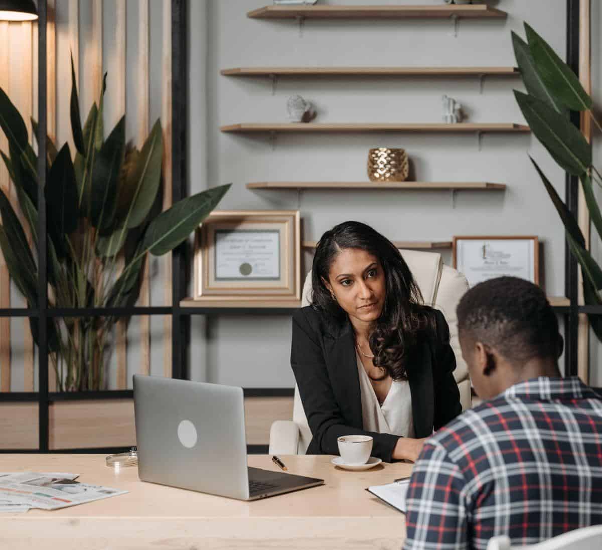 business professional working with a client at her firm
