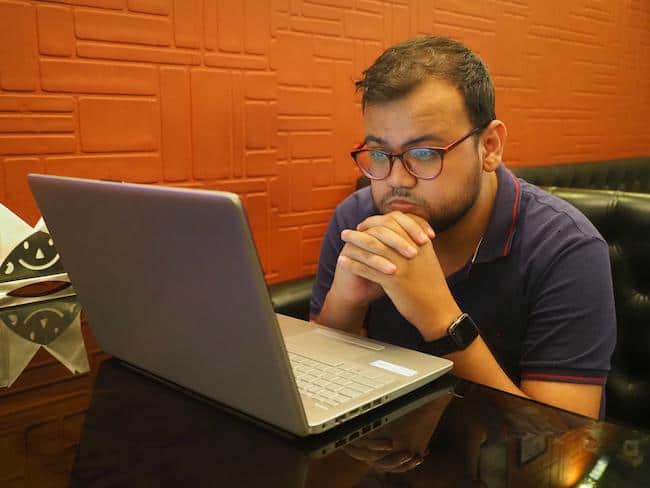 computer repairman working on a laptop