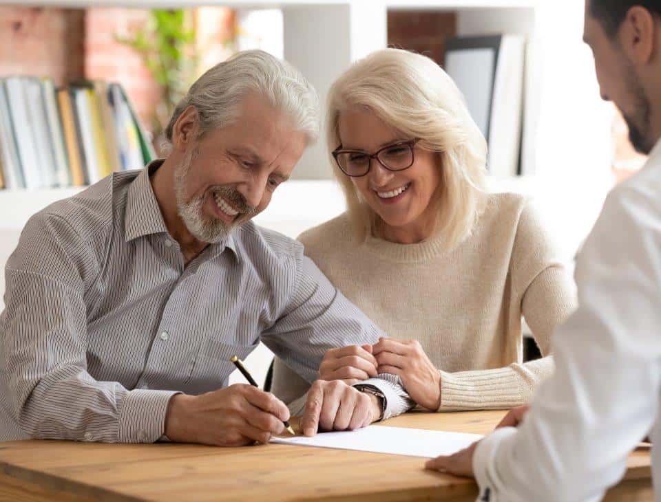 couple signing a life insurance policy in ohio