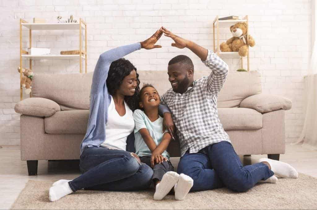Family in their new home after getting homeowners insurance coverage