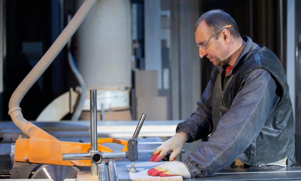 man working at a machine parts manufacturing facility